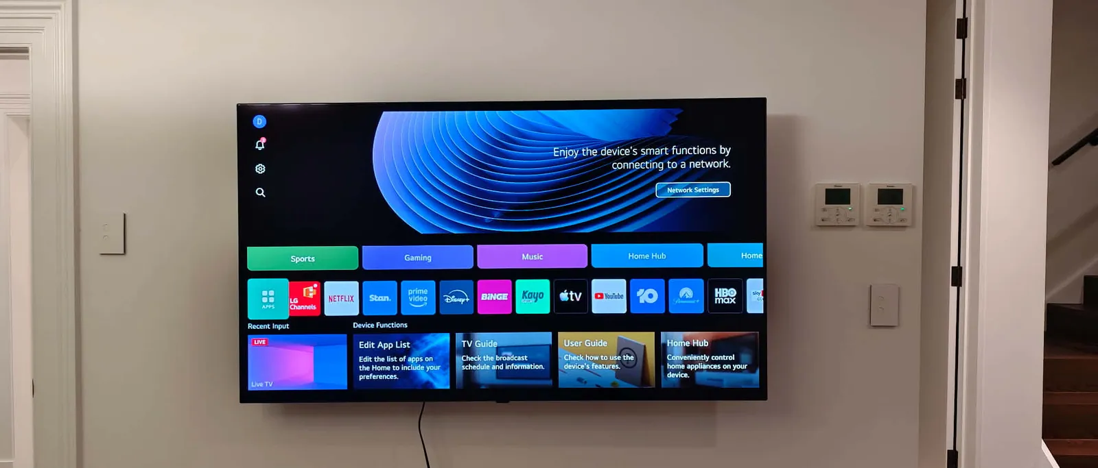 TV mounted on a hallway wall