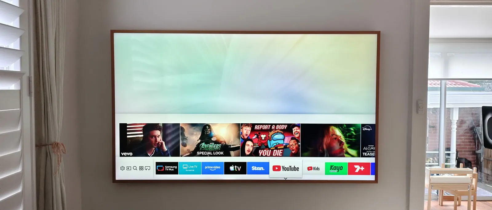 Samsung Frame TV in art mode wall mounted